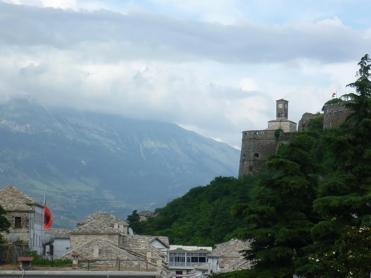 The Ottoman clock tower and stone houses of Gjirokaster old town climbing the hillside