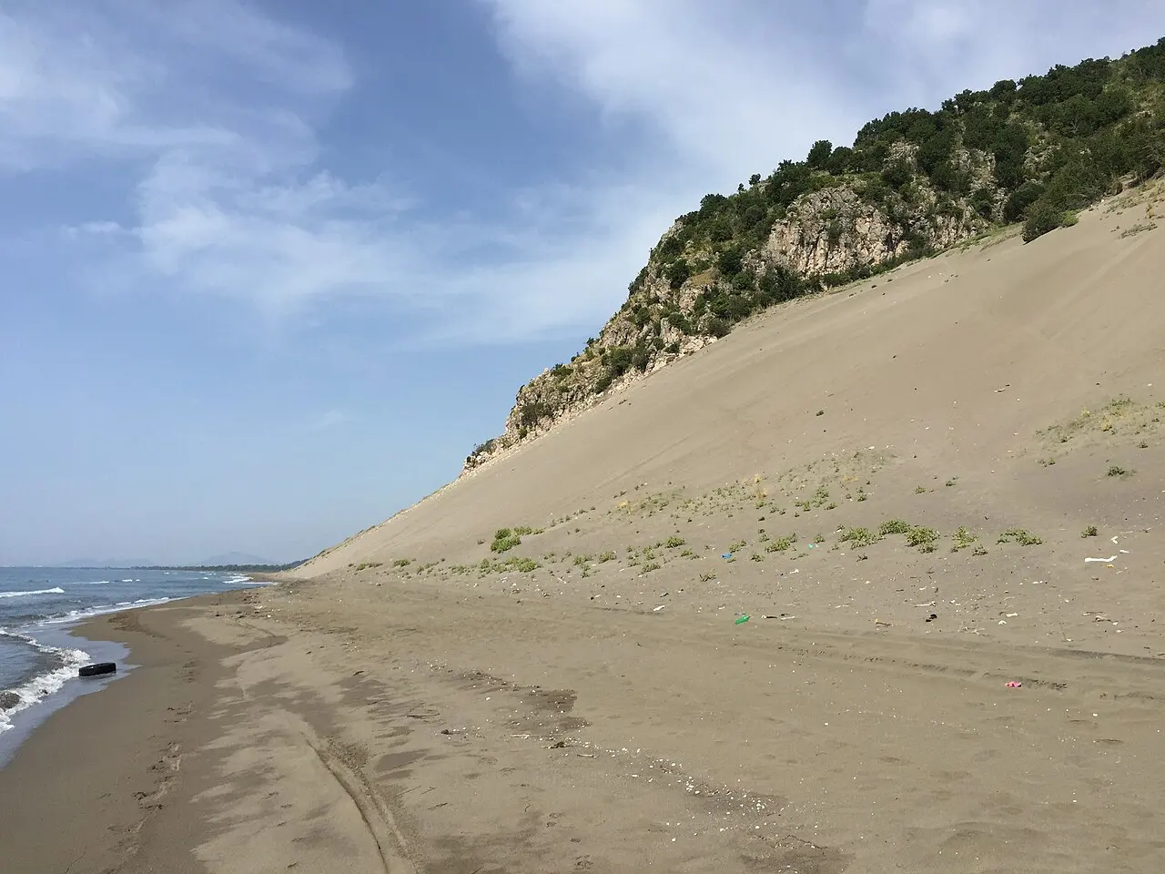 The huge sand dune of Rana e Hedhun rising from the beach at Shëngjin on Albania's Adriatic coast