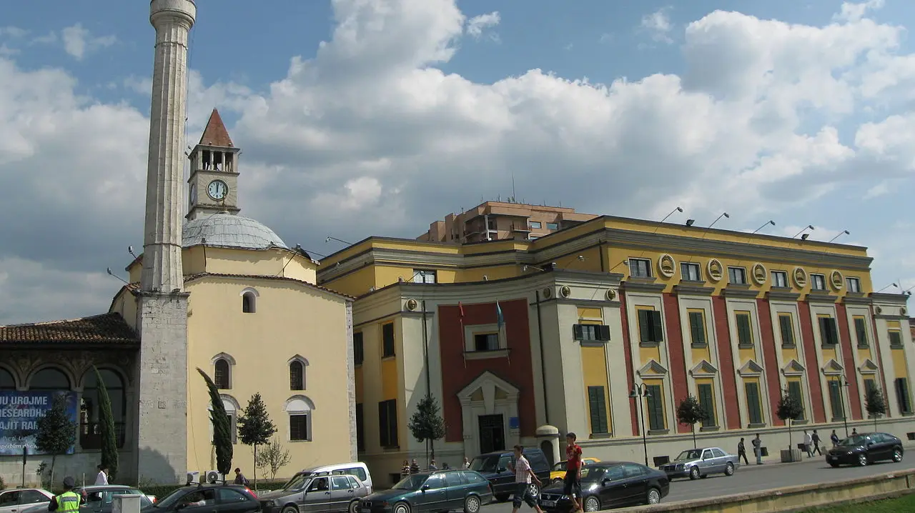 The Ethem Bey Mosque and clock tower beside the city hall on Skanderbeg Square in central Tirana