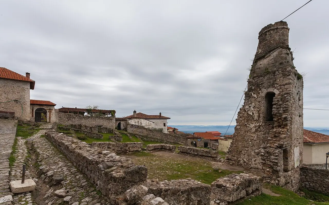The stone ruins and old houses inside Kruja castle on the mountainside above the plain