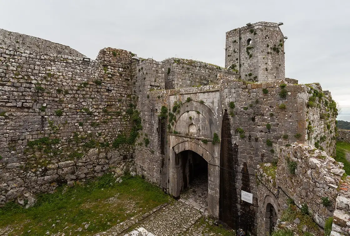 The stone walls of Rozafa Castle above Shkodra with the lake and plain behind