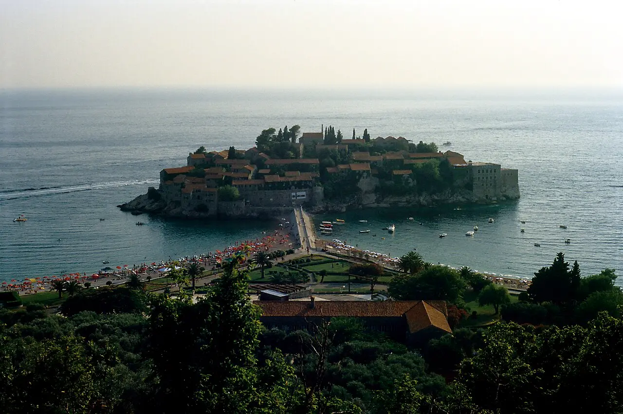 The fortified islet of Sveti Stefan joined to the mainland by a narrow causeway on the Montenegrin coast