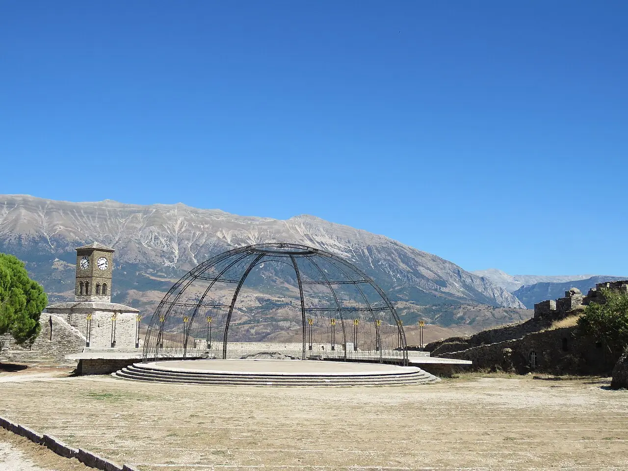Clock tower on Gjirokaster Castle terrace with festival stage seating