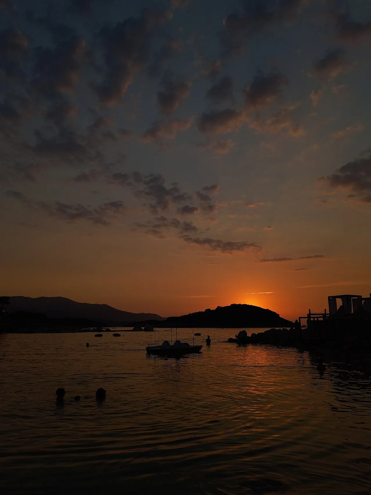 Sunset over the sea at Ksamil on the Albanian Riviera with warm light across the water