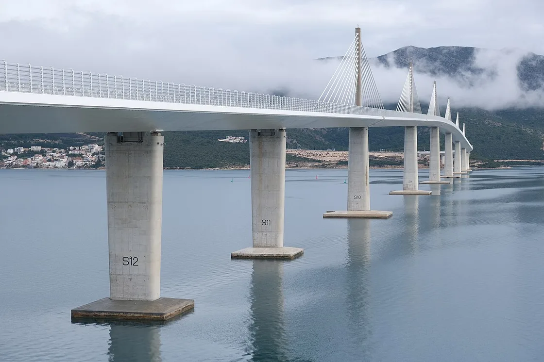 The Peljesac Bridge curving over the sea between the Croatian mainland and the Peljesac peninsula