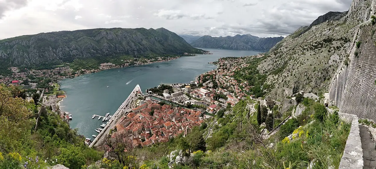 A high view over Kotor old town at the head of the Bay of Kotor, ringed by grey mountains