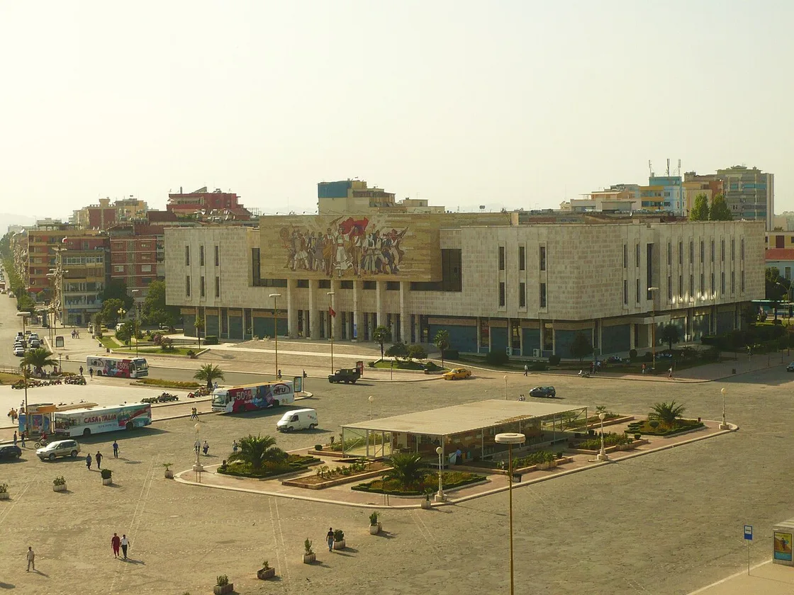 Skanderbeg Square in Tirana seen from the clock tower, with the mosque, the plaza and the mountains behind