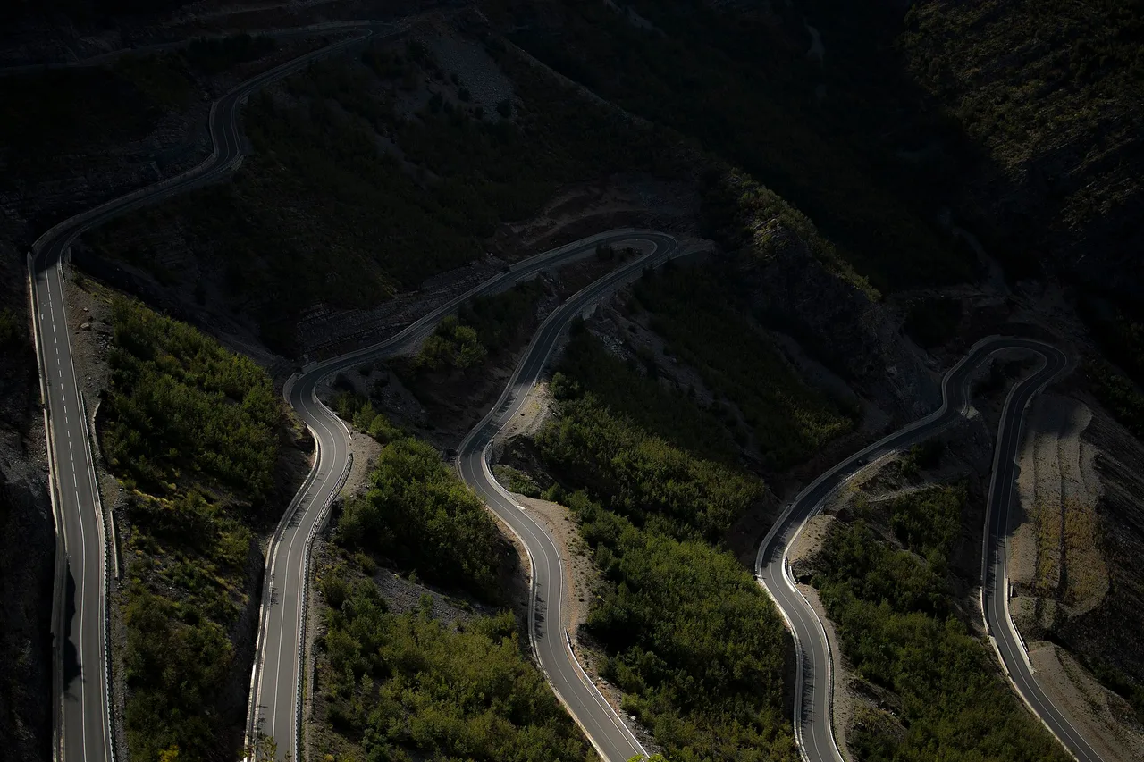 The road approaching the Hani i Hotit crossing on the Albania-Montenegro border, mountains behind