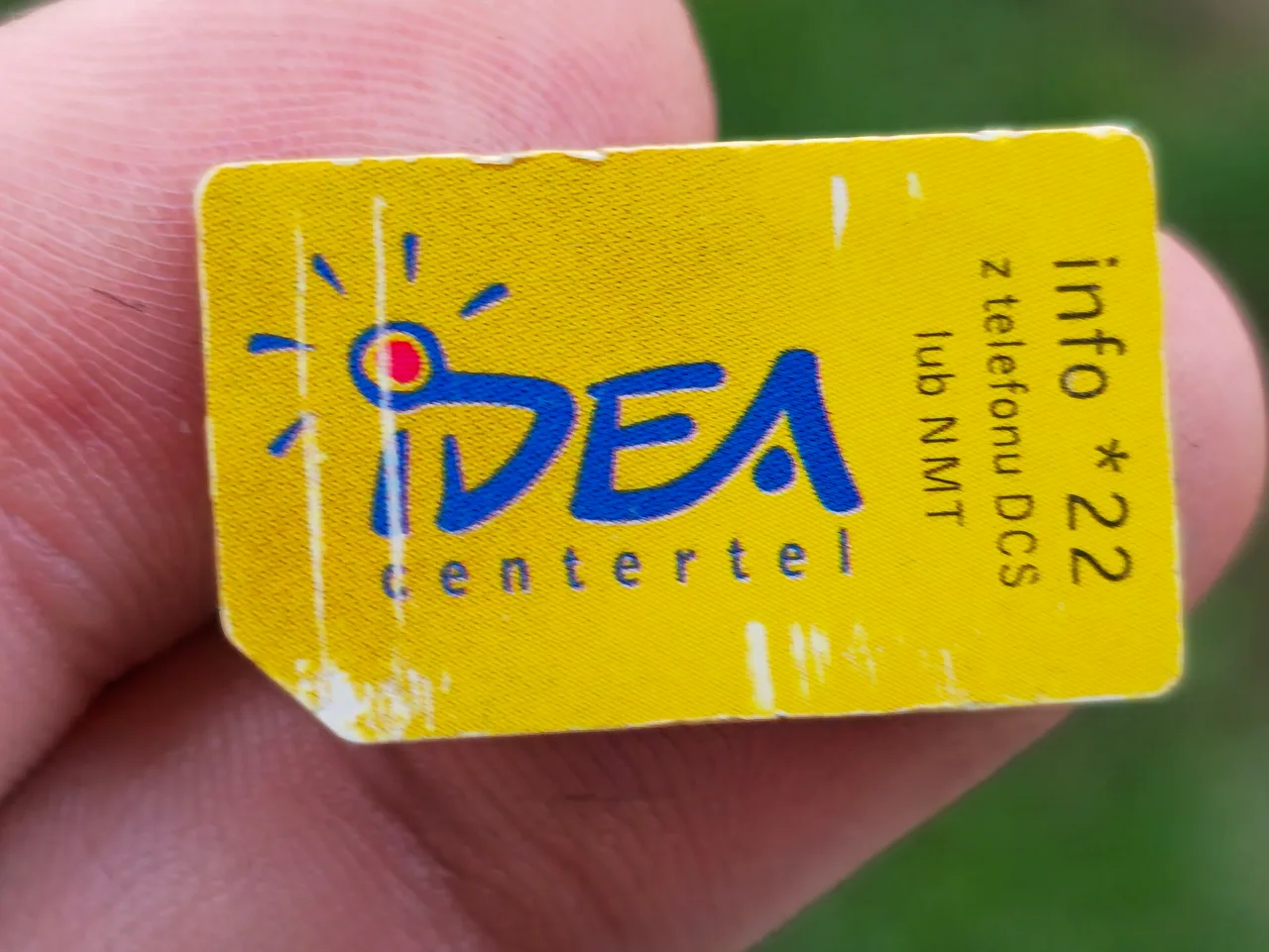 A prepaid SIM card in close-up, chip contacts facing the camera