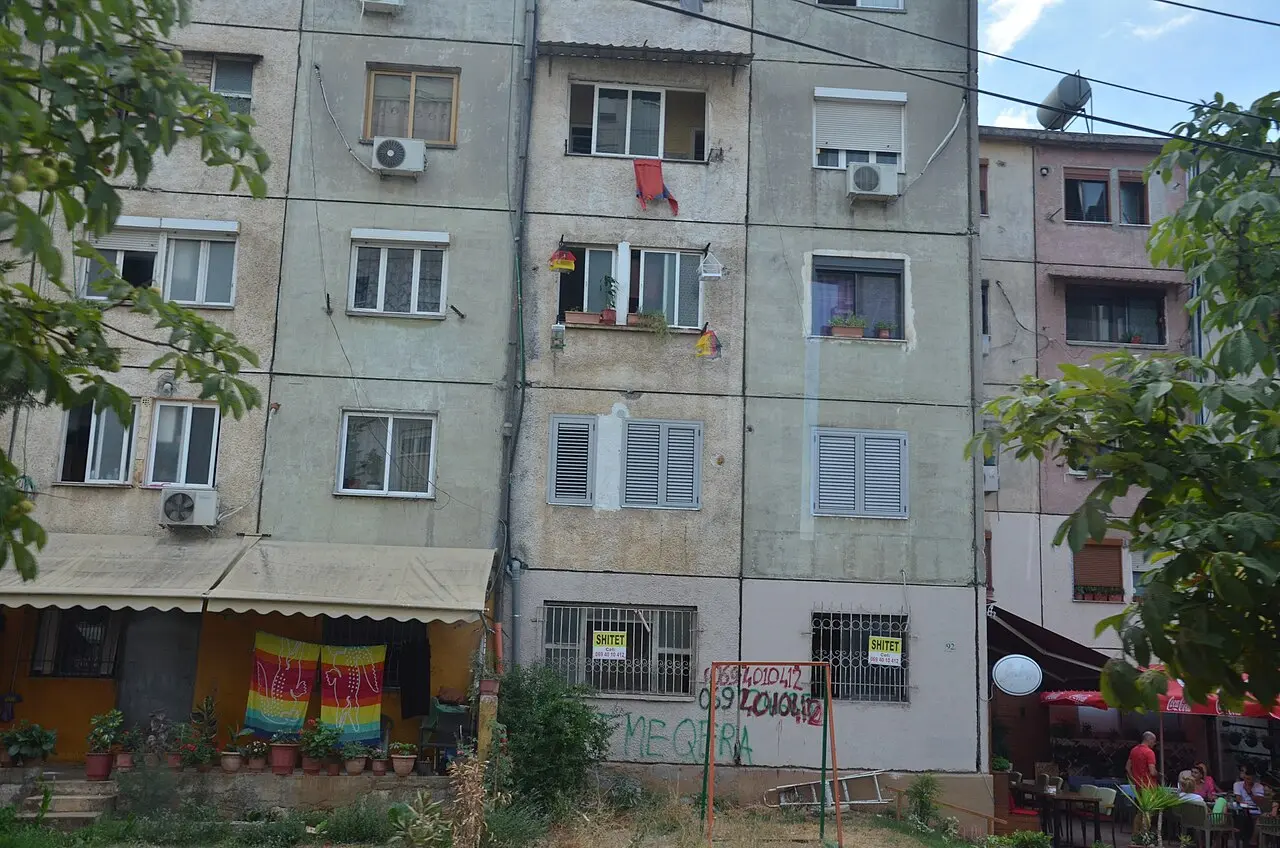Residential apartment blocks lining a street in Tirana