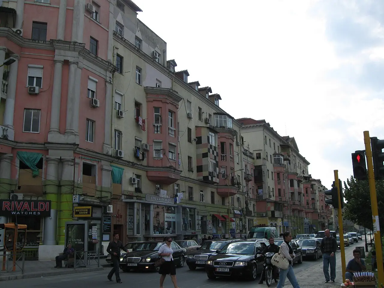 Colourful mid-rise buildings along a Tirana avenue
