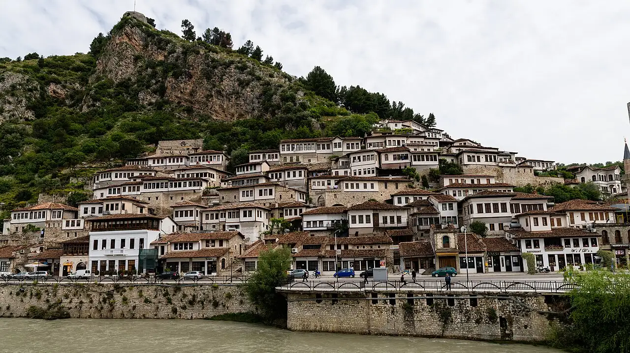 The stacked white Ottoman houses of the Mangalem quarter rising up the hillside in Berat above the Osum river