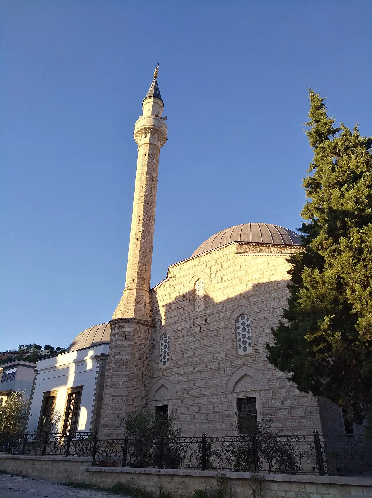 The tall stone minaret and lead-covered dome of the Lead Mosque (Xhamia e Plumbit) in Berat