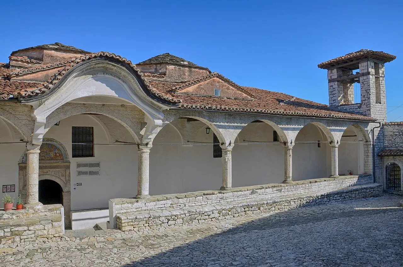 The porticoed Church of the Dormition of St Mary housing the Onufri Museum inside Berat castle, with its bell tower