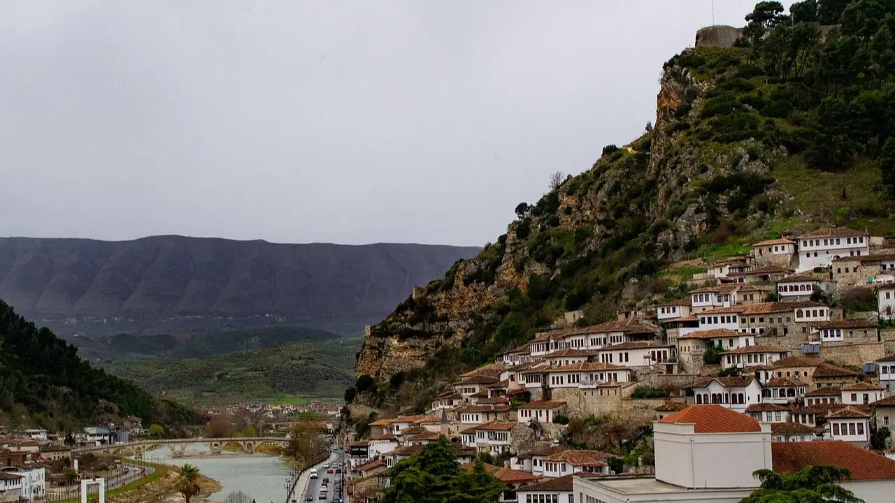 Panorama of Berat with white Ottoman houses climbing the hillside above the Osum river, the thousand-windows view that defines the central Albanian town