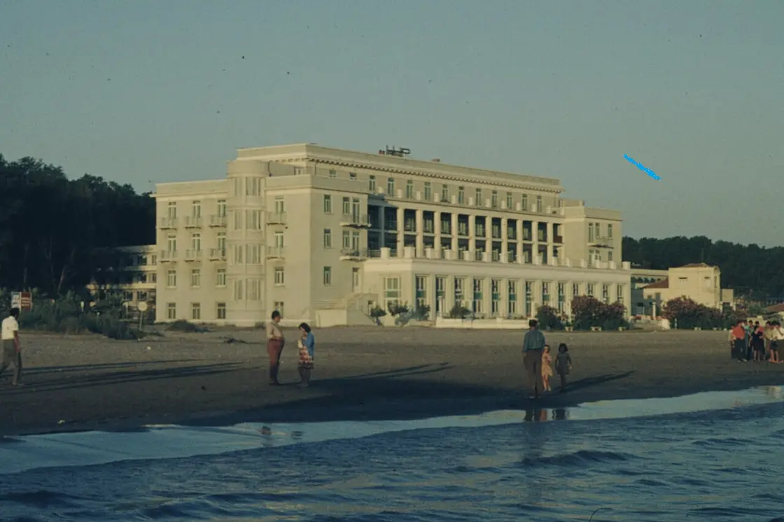 A large seafront resort hotel building in Durres, Albania, seen from the beach side