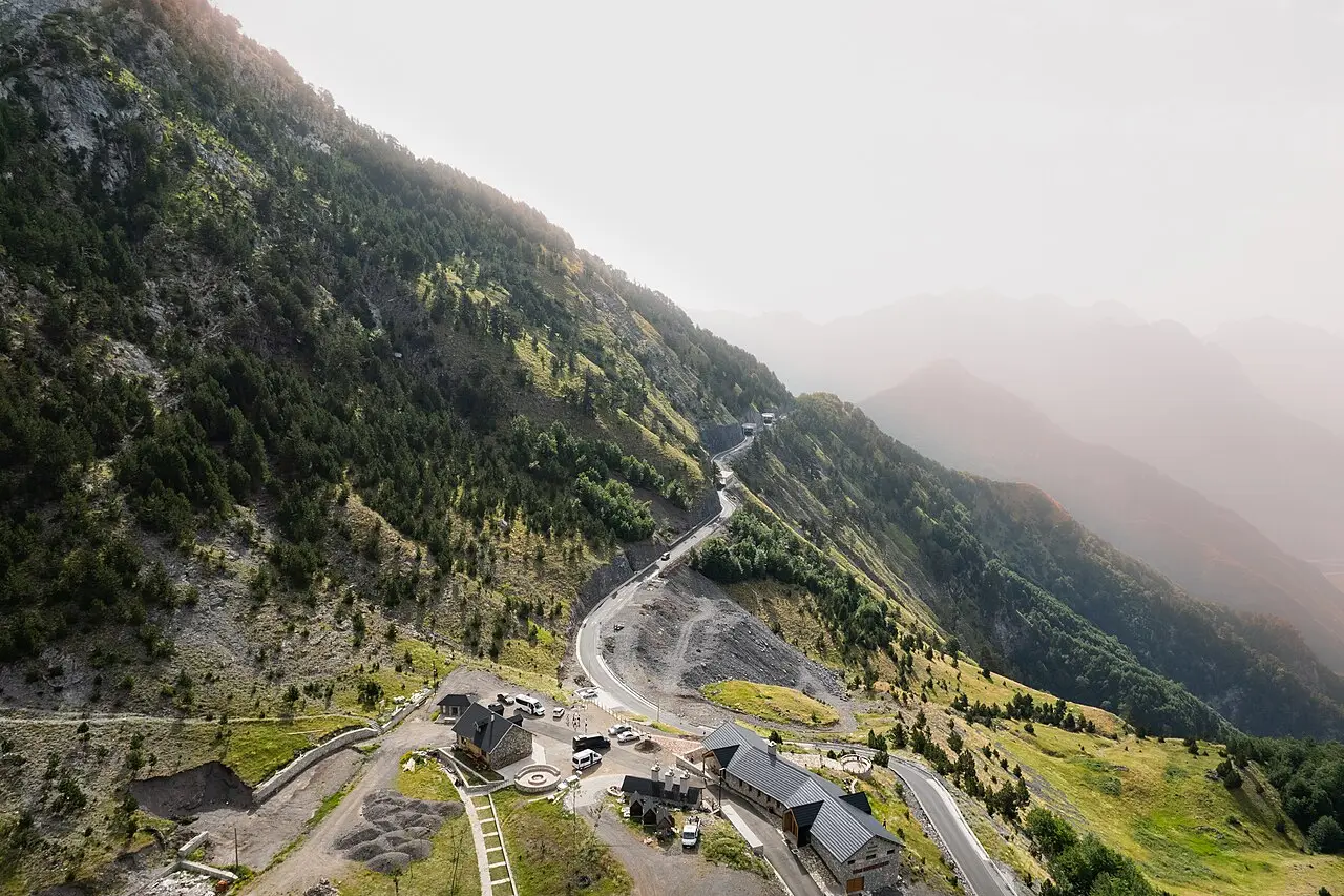A winding mountain road climbing toward Theth in the Albanian Alps