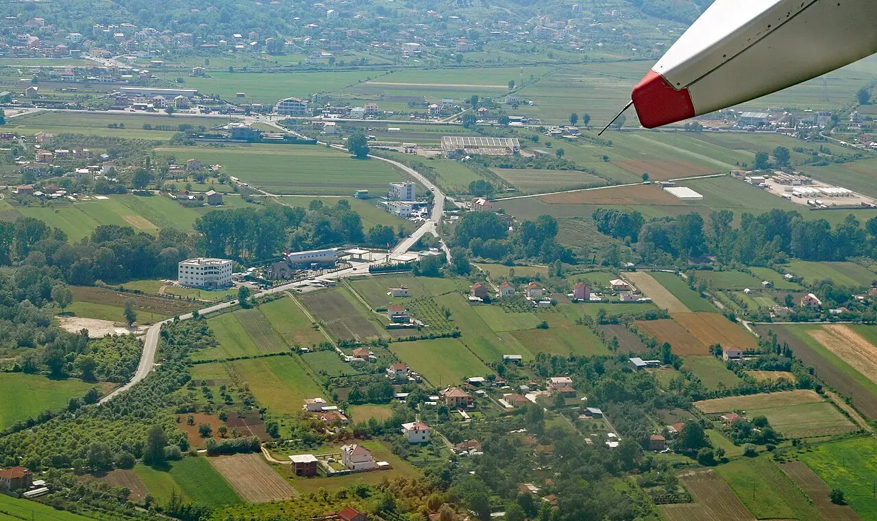 Aerial view of Rinas and the flat plain around Tirana Airport northwest of the city
