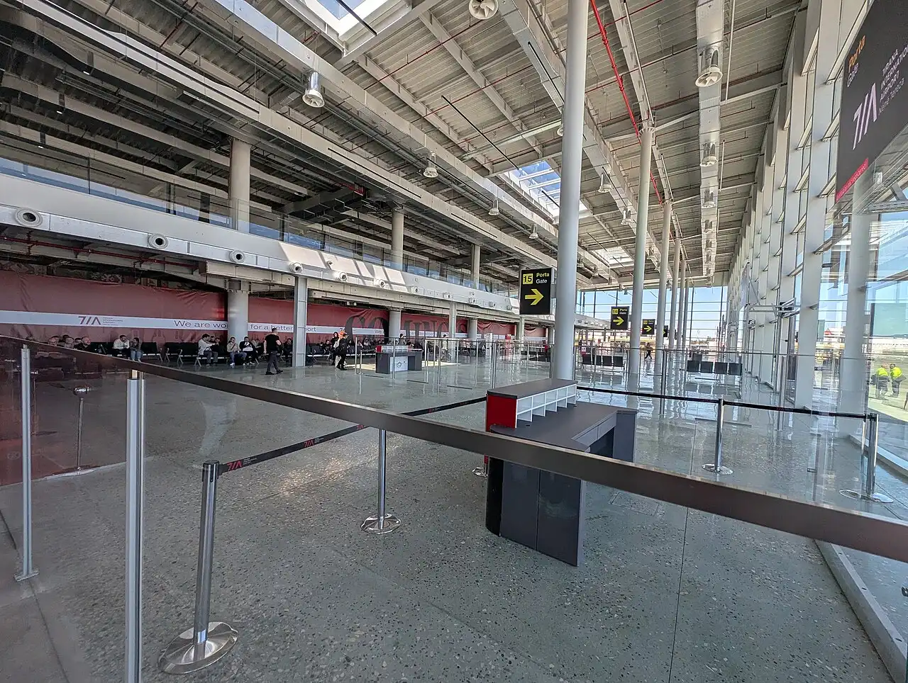 The frontage of the Tirana Airport passenger terminal with the covered arrivals area