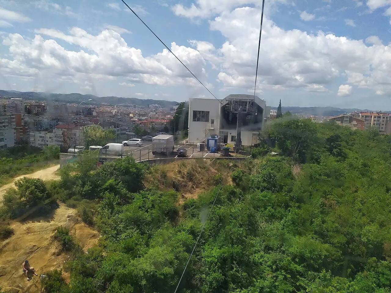 View from a Dajti Ekspres cabin back over the lower station and the rooftops of Tirana