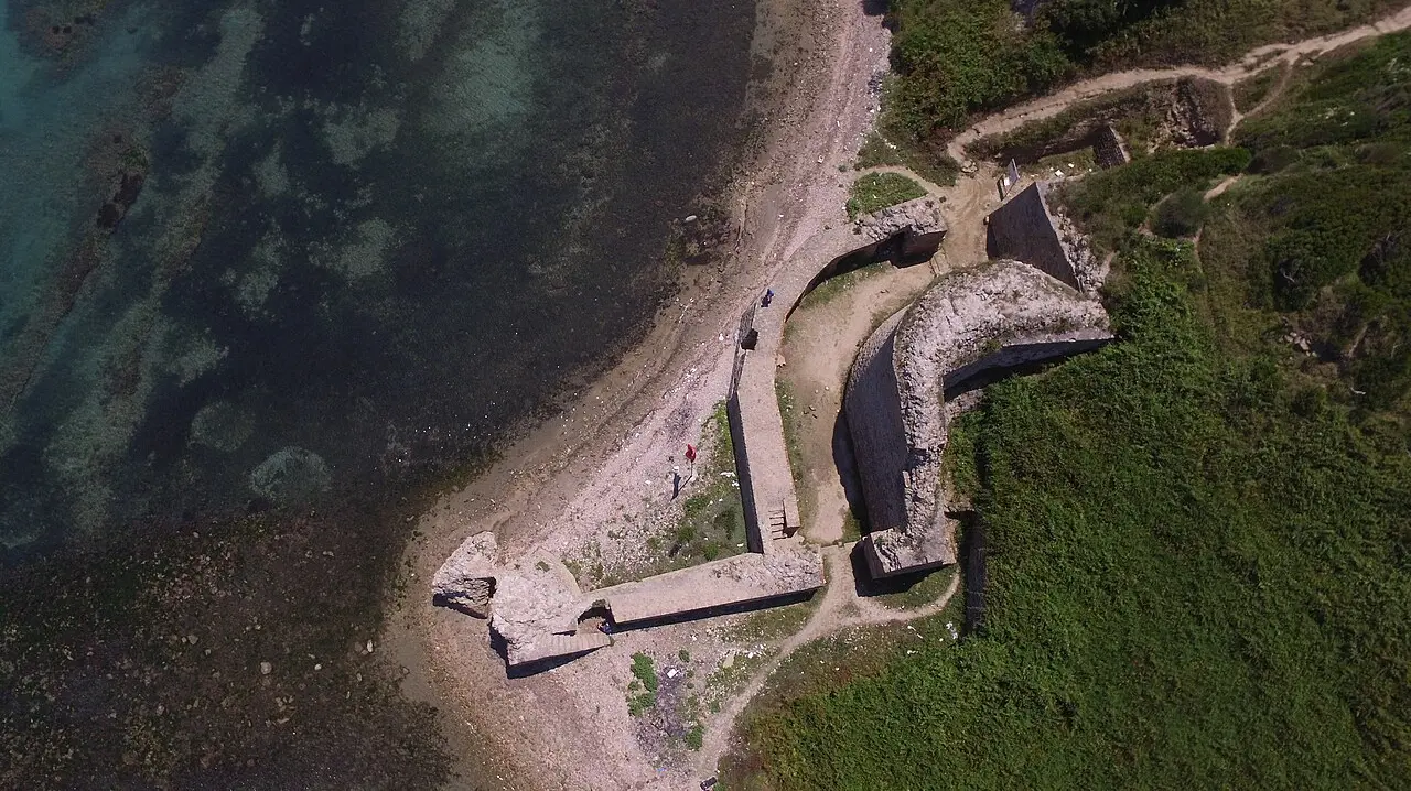 Stone walls of Rodoni Castle on Cape Rodon, with the Adriatic stretching out beyond the fort