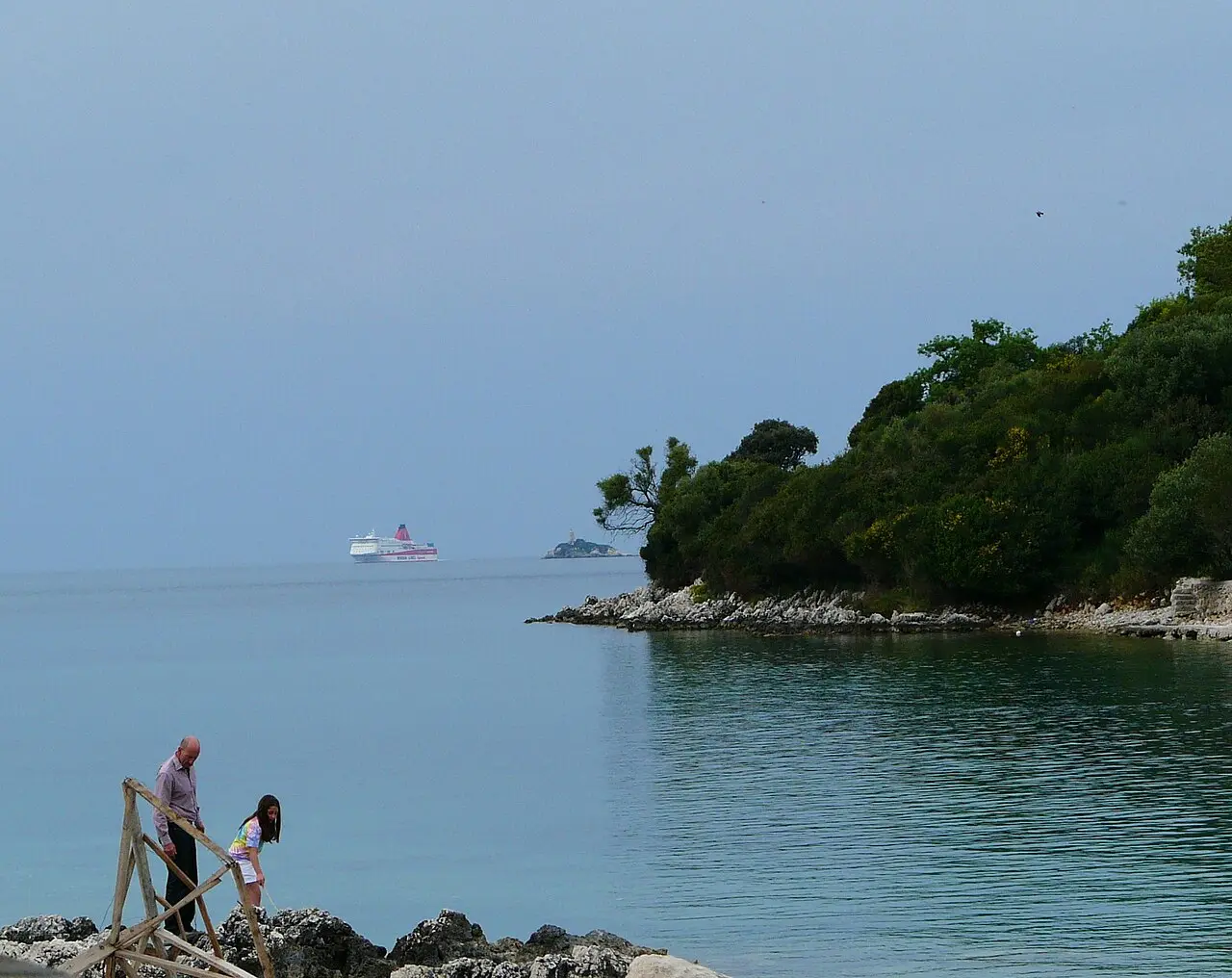 A passenger ferry crossing the narrow strait between Albania and Corfu