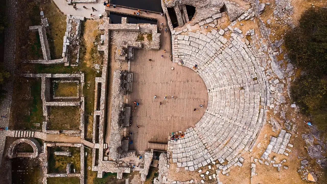 Aerial view of the ancient Greek theatre and ruins of Butrint from directly above
