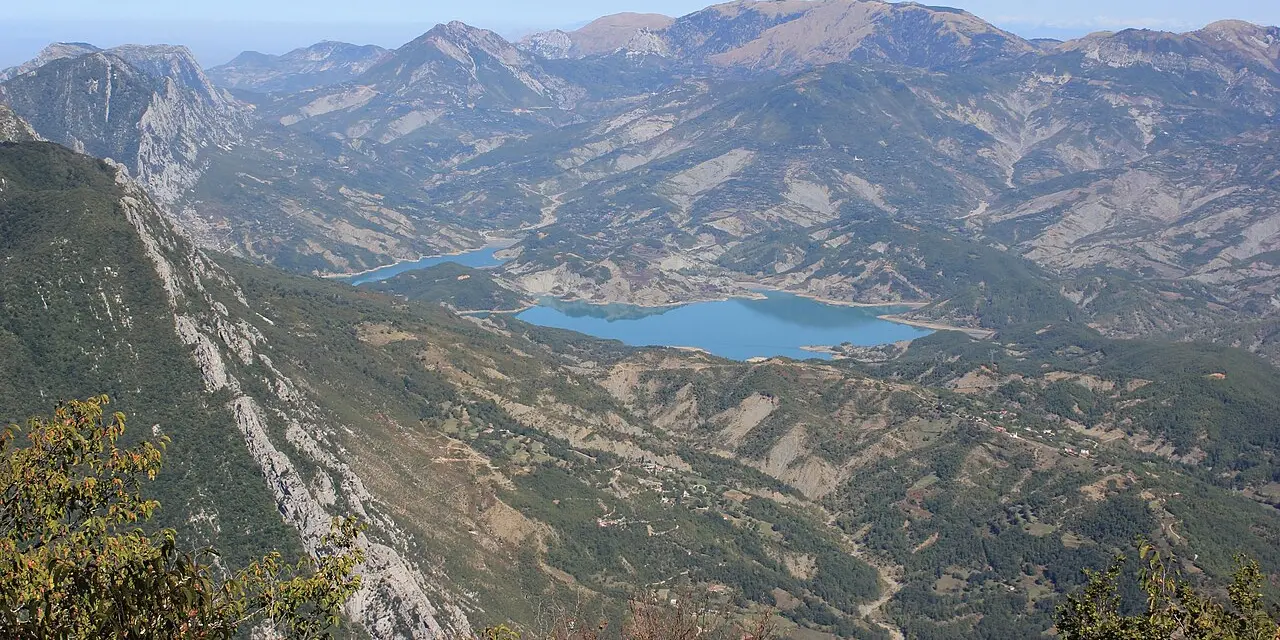A wide mountain view from Dajti with a turquoise reservoir far below, the kind of landscape within reach of Tirana
