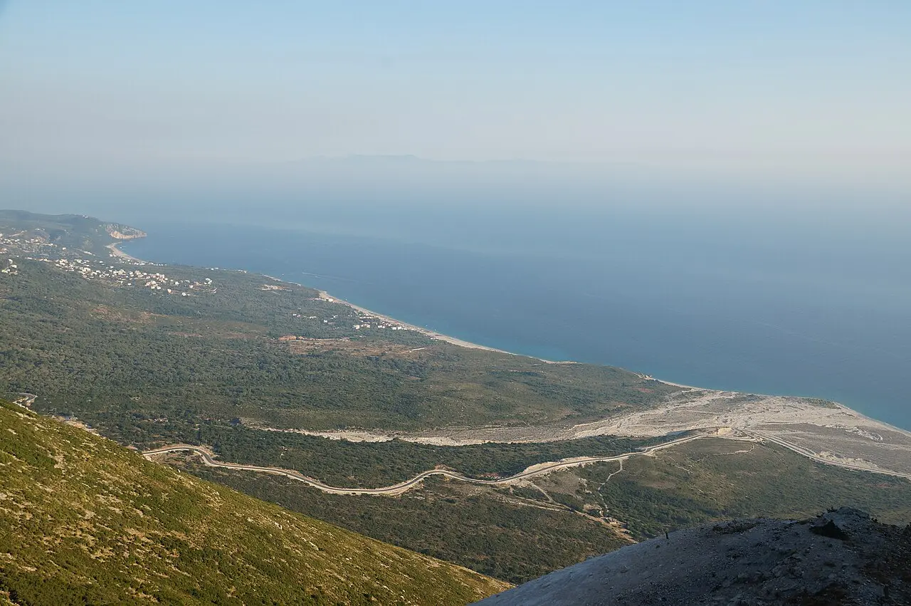 Aerial view of the Drymades and Palasa beaches curving along the Ionian coast north of Dhermi