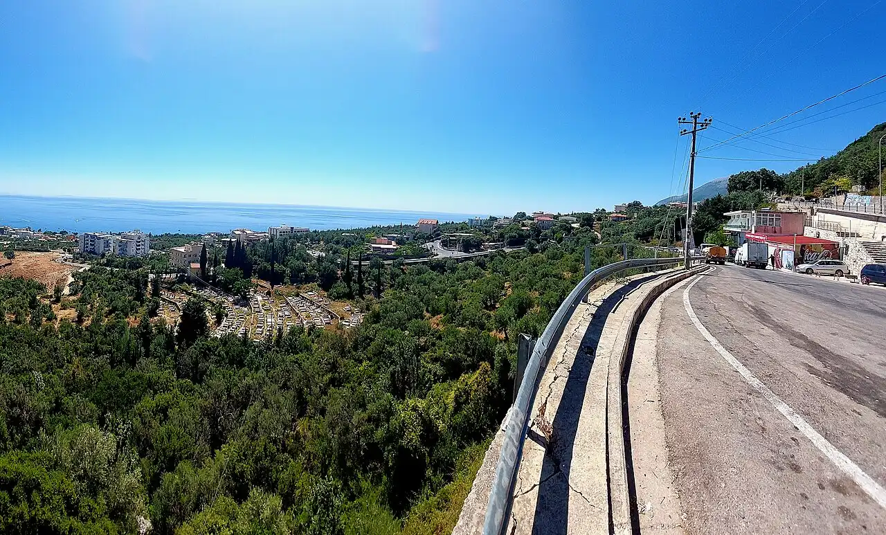 The old village of Dhermi on its mountain slope with stone houses and the sea far below