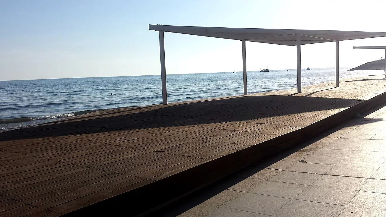 The wide sandy beach of Durrës lined with hotels and beach bars in summer