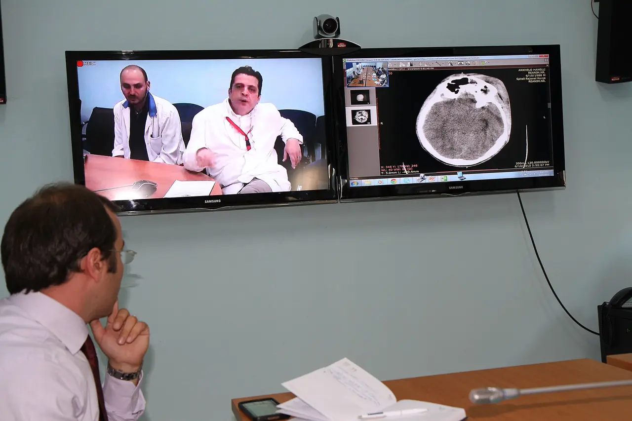 Medical staff reviewing a telemedicine workstation in an Albanian hospital setting
