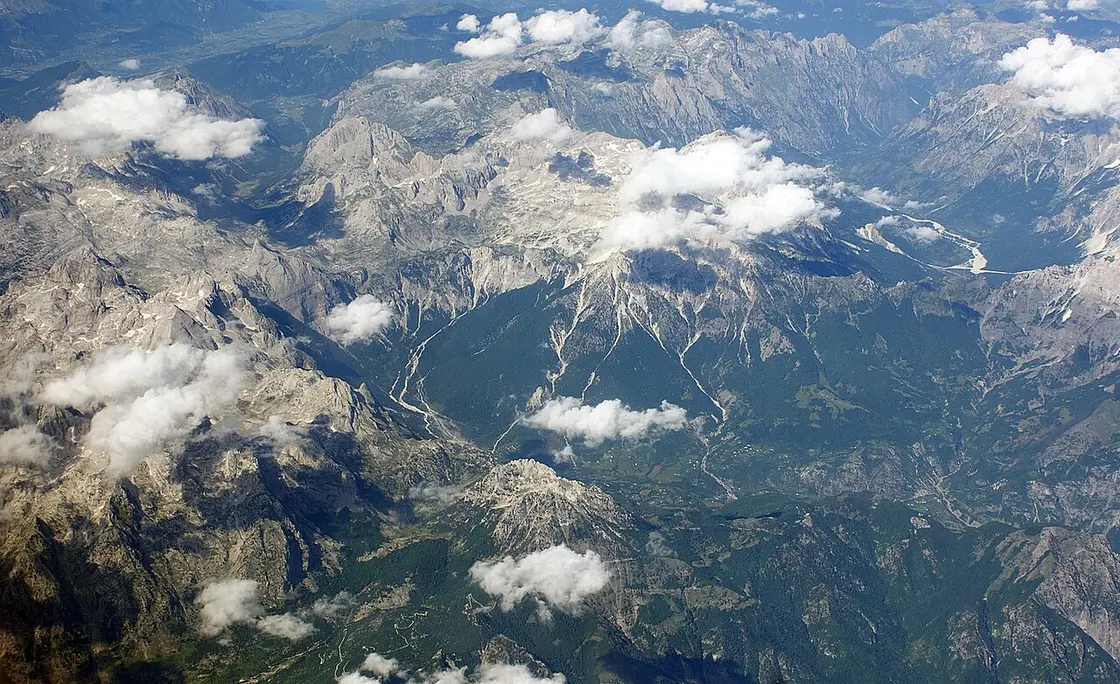 Aerial view of the Albanian Alps, a dome of peaks and forested valleys