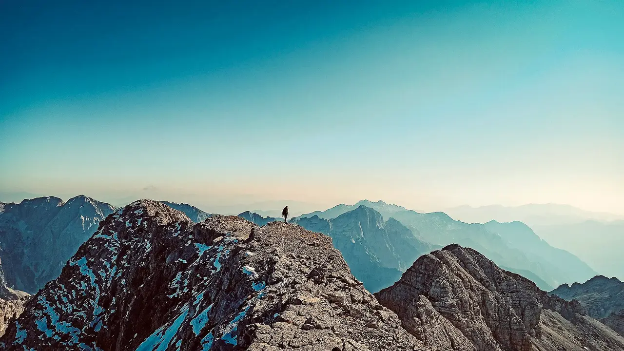 The limestone pyramid of Jezerca, the highest peak in the Accursed Mountains, under a clear sky