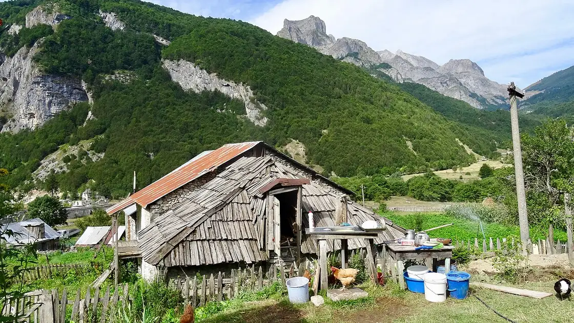 Open high meadows and distant peaks on the Peaks of the Balkans trail