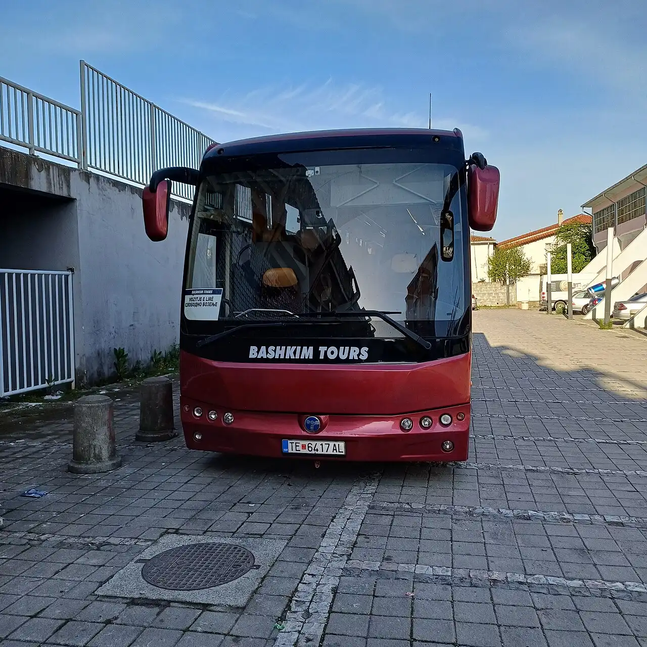 A parked intercity coach belonging to a private Albanian bus operator