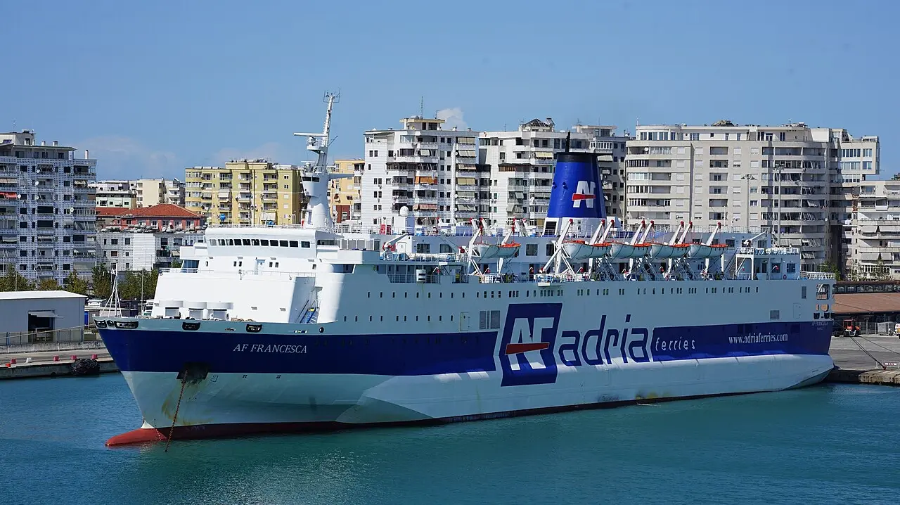 The Adria Ferries vessel AF Francesca docked at the Port of Durres in Albania with the city behind