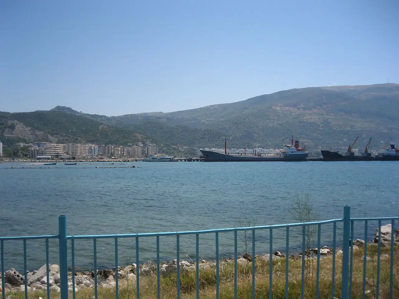 The harbour and bay at Vlore in southern Albania with ships moored and green mountains behind