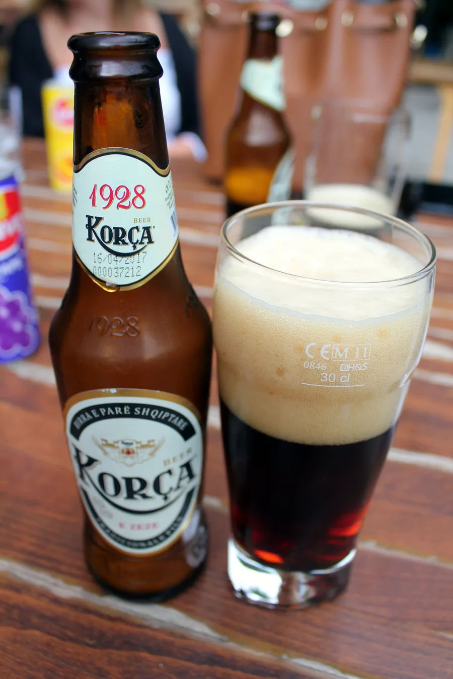 A glass of dark Birra Korça beer, the brewery whose name the festival carries