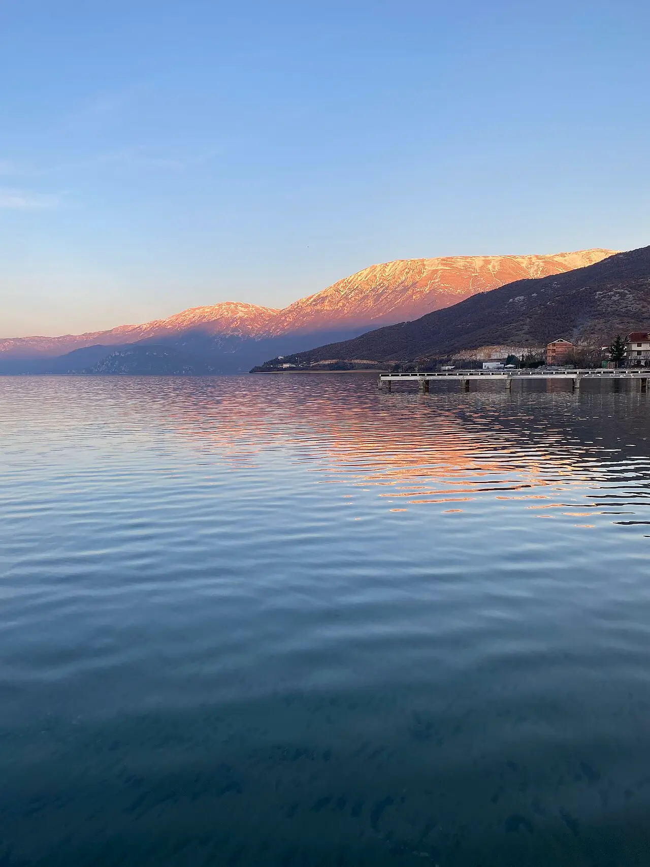 The calm blue water of Lake Ohrid seen from the shore at Pogradec, Albania