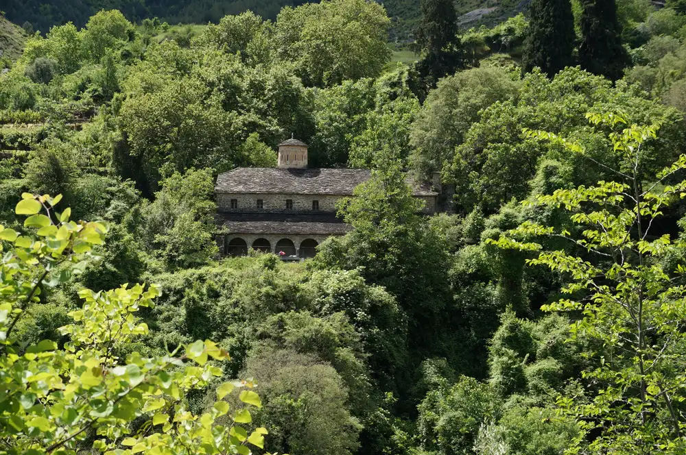 The stone exterior of Leusa church in the forest near Permet, one of the largest Orthodox churches in southern Albania