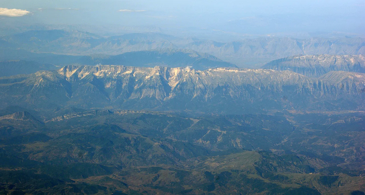 Aerial view of the Nemercka mountain range that rises above Permet and the Vjosa valley