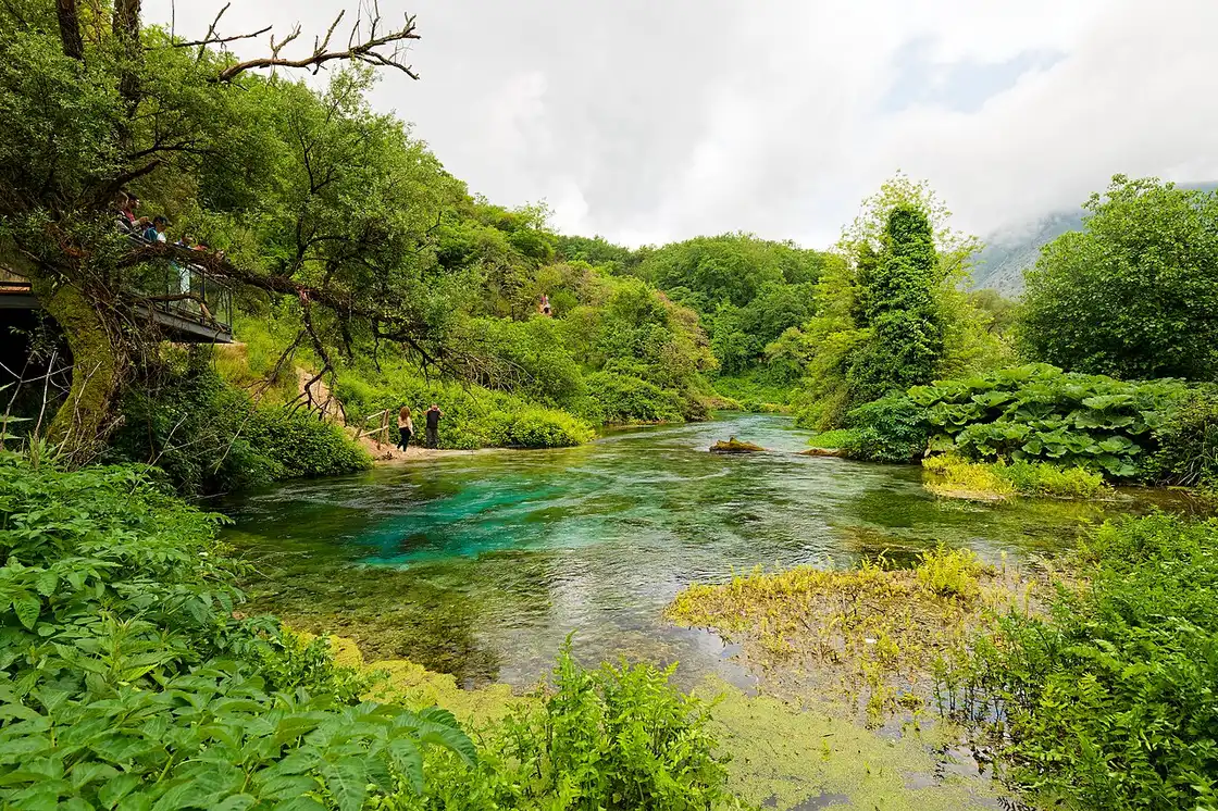 The deep turquoise water of the Blue Eye karst spring near Saranda