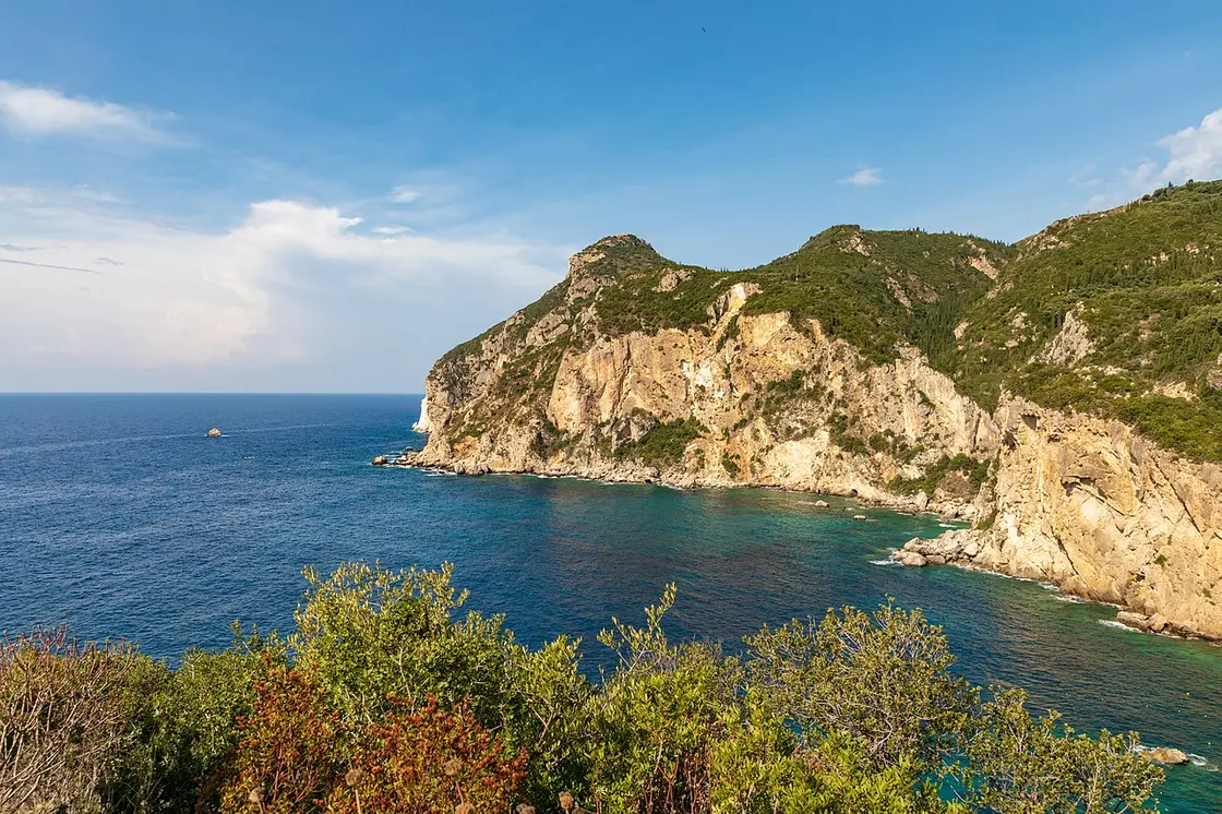 The coves and headlands of Paleokastritsa on the west coast of Corfu with clear turquoise water