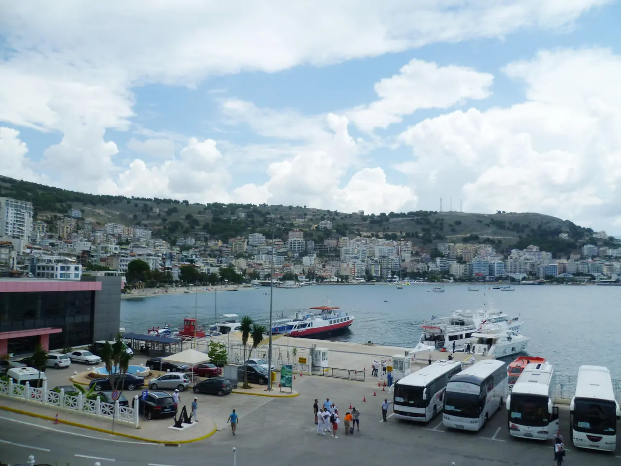 Sarandë harbour on the Albanian Riviera with boats moored along the waterfront and the town rising behind