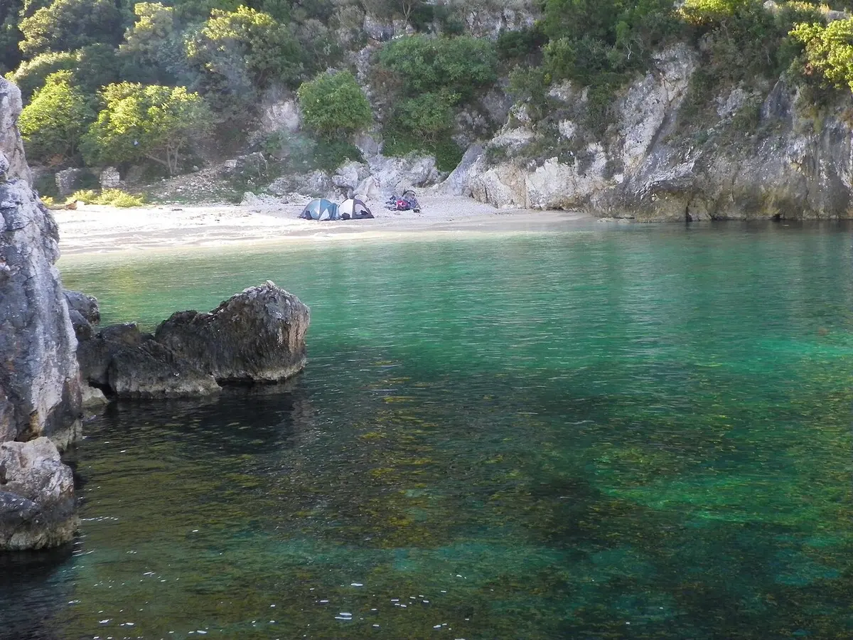 A remote turquoise cove on the Karaburun peninsula, part of the marine park reached by boat from Vlora