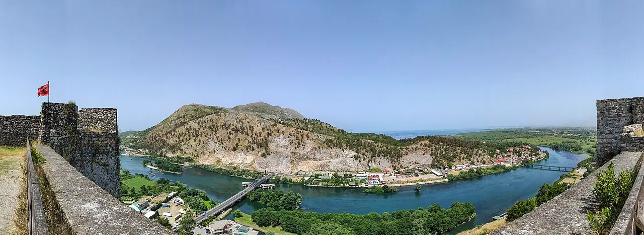 A wide view of the flat expanse of Lake Shkodra from the castle hill