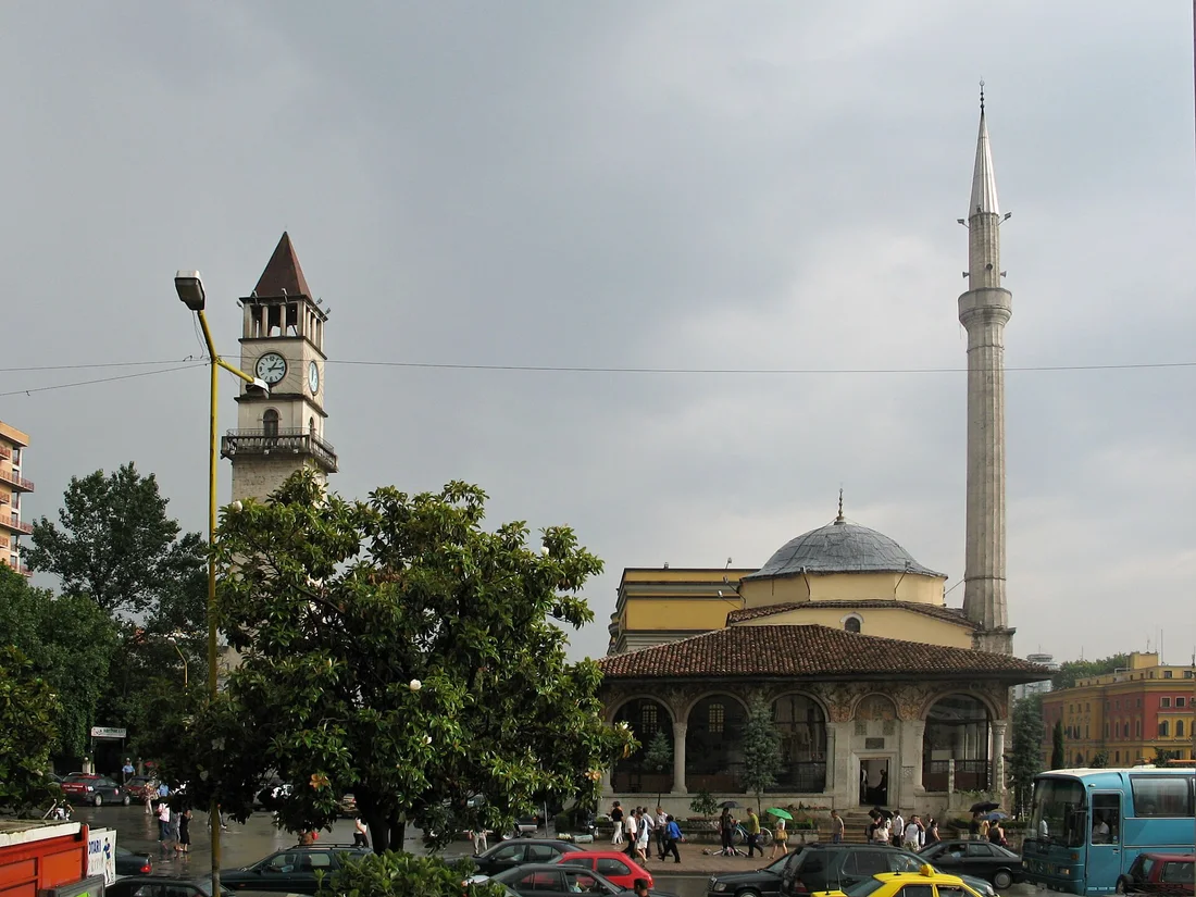 Et'hem Bey Mosque with its dome and minaret, the Clock Tower rising behind it
