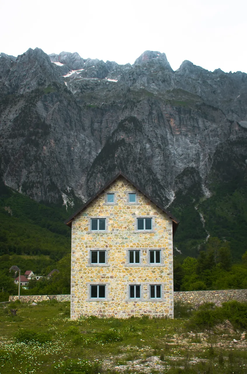 A traditional stone-roofed house in the Theth valley used as a mountain guesthouse