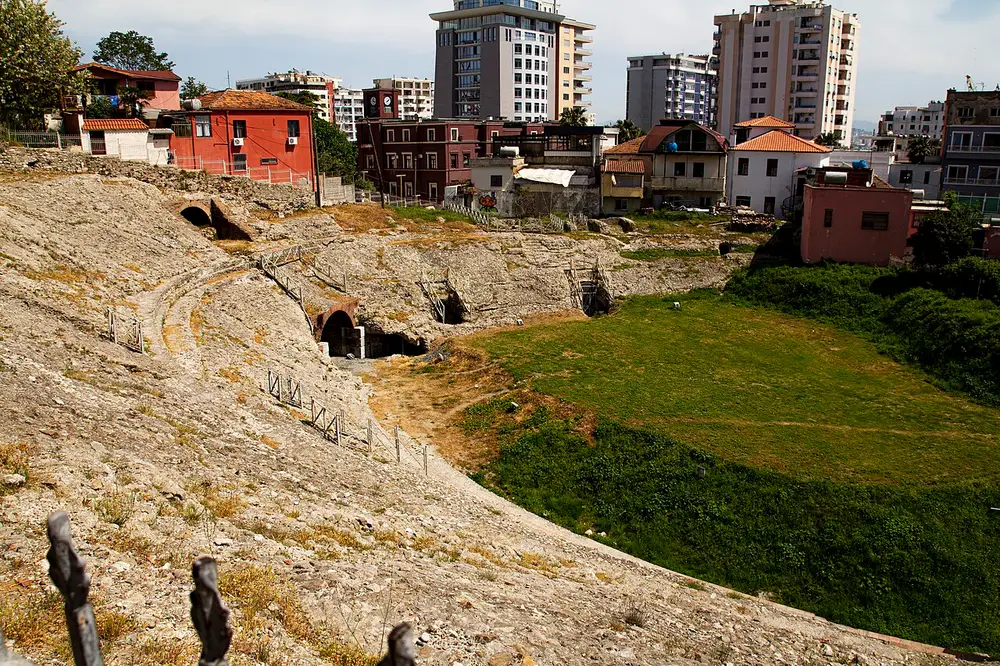 The Roman amphitheatre of Durres set among modern houses and apartment blocks in Albania